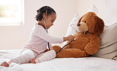 Buy stock photo Girl, teddy bear and stethoscope in hospital game in medical, healthcare and wellness bedroom. Happy smile, curious orphan child or fun patient in medicine play activity in pediatric community center