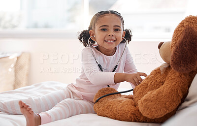 Buy stock photo Children, stethoscope and teddy bear with a girl playing doctor in her bedroom at home with a stuffed animal. Imagination, healthcare and medicine with a cute female child being a pretend nurse