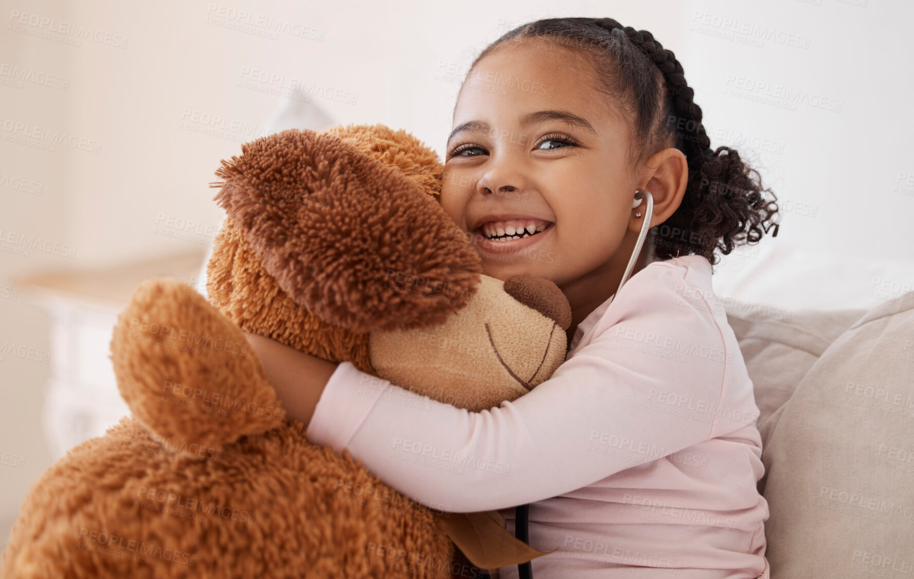 Buy stock photo Children, teddy bear and girl with a child hugging her stuffed animal with a smile in her house. Kids, happy and safe with an adorable or cute female kid holding a fluffy toy while sitting on a bed