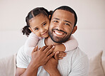 Children, family and love with a girl and her father hugging, embracing and bonding together in their home. Kids, smile and happy with a man and his daughter enjoying time with a loving expression
