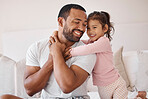 Love, father and family morning hug in bedroom together with child for joyful parent bond. Dad smiling with young daughter holding his back in a happy home with care, support and trust.