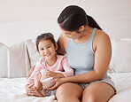 Happy baby and mother in a bedroom portrait for love, support and child care. Excited, relax and happiness of mom holding and bonding with a kid girl for healthy growth child development