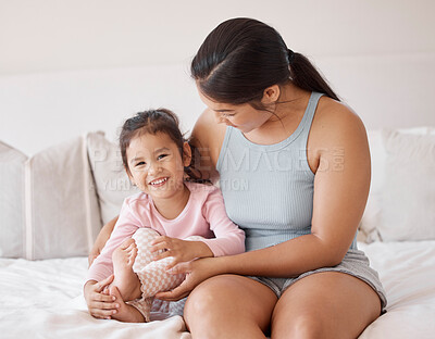 Buy stock photo Happy baby and mother in a bedroom portrait for love, support and child care. Excited, relax and happiness of mom holding and bonding with a kid girl for healthy growth child development