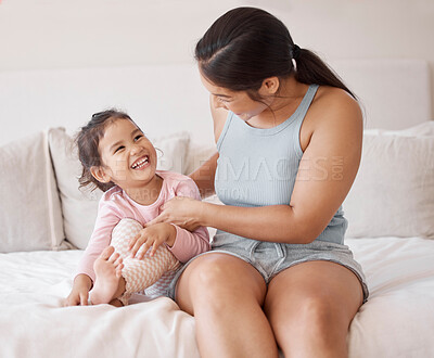 Buy stock photo Mother with girl child on bed play, smile and laughing at comedy comic funny joke together in home bedroom. Happy woman or excited mom and young kid love smiling and enjoy playful bonding in house