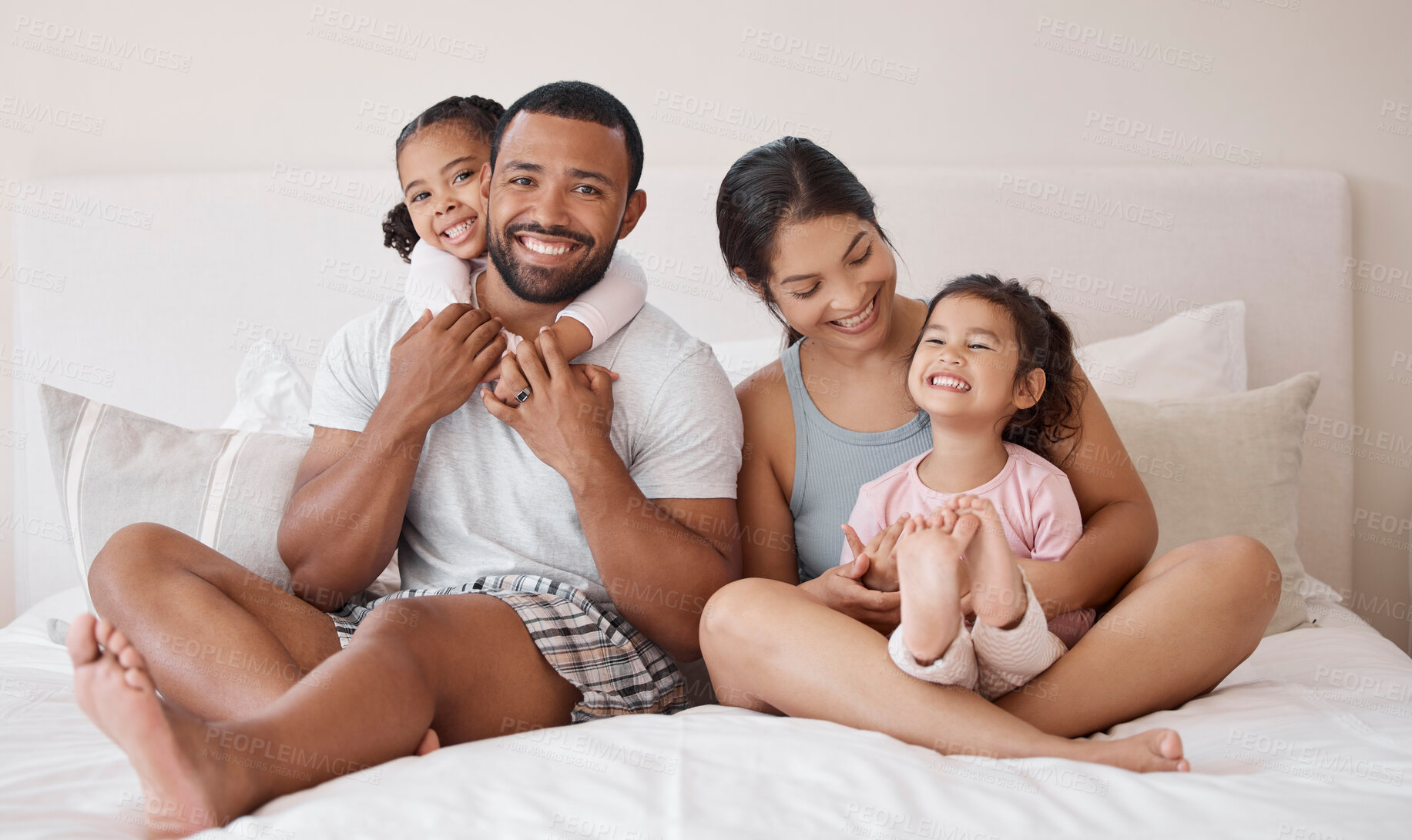 Buy stock photo Portrait, happy and family in bed with smile, hug and love while relax in the morning. Parents bonding with their children in the bedroom with happiness, care and healthy relationship in home 