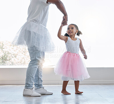 Buy stock photo Young girl, learning ballet with dad or teacher for fitness, fun and health at house. Female child dancer in costume dress, dancing with father or dance instructor, lesson on home porch or balcony