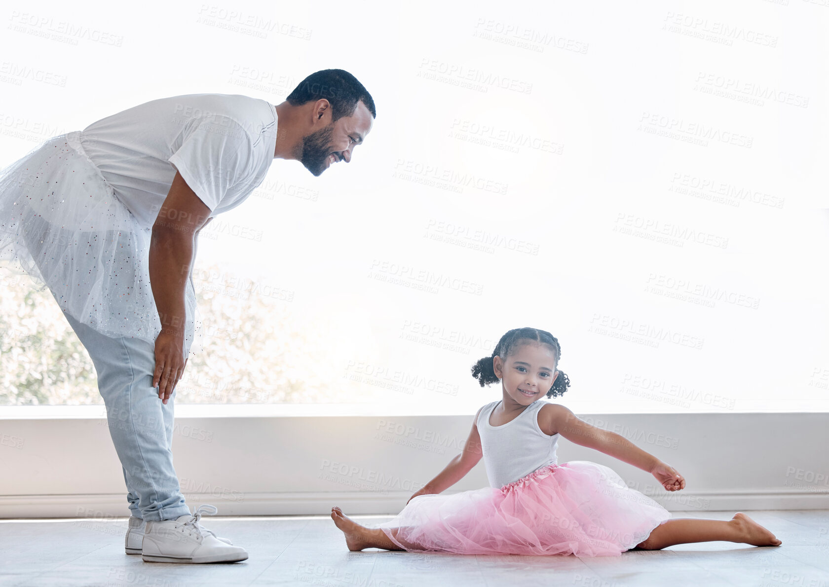 Buy stock photo Ballerina girl, father and daughter dancing for fun and learning ballet dance and bonding at home. Happy man and child playing and spending time together wearing tutu for lesson and family activity