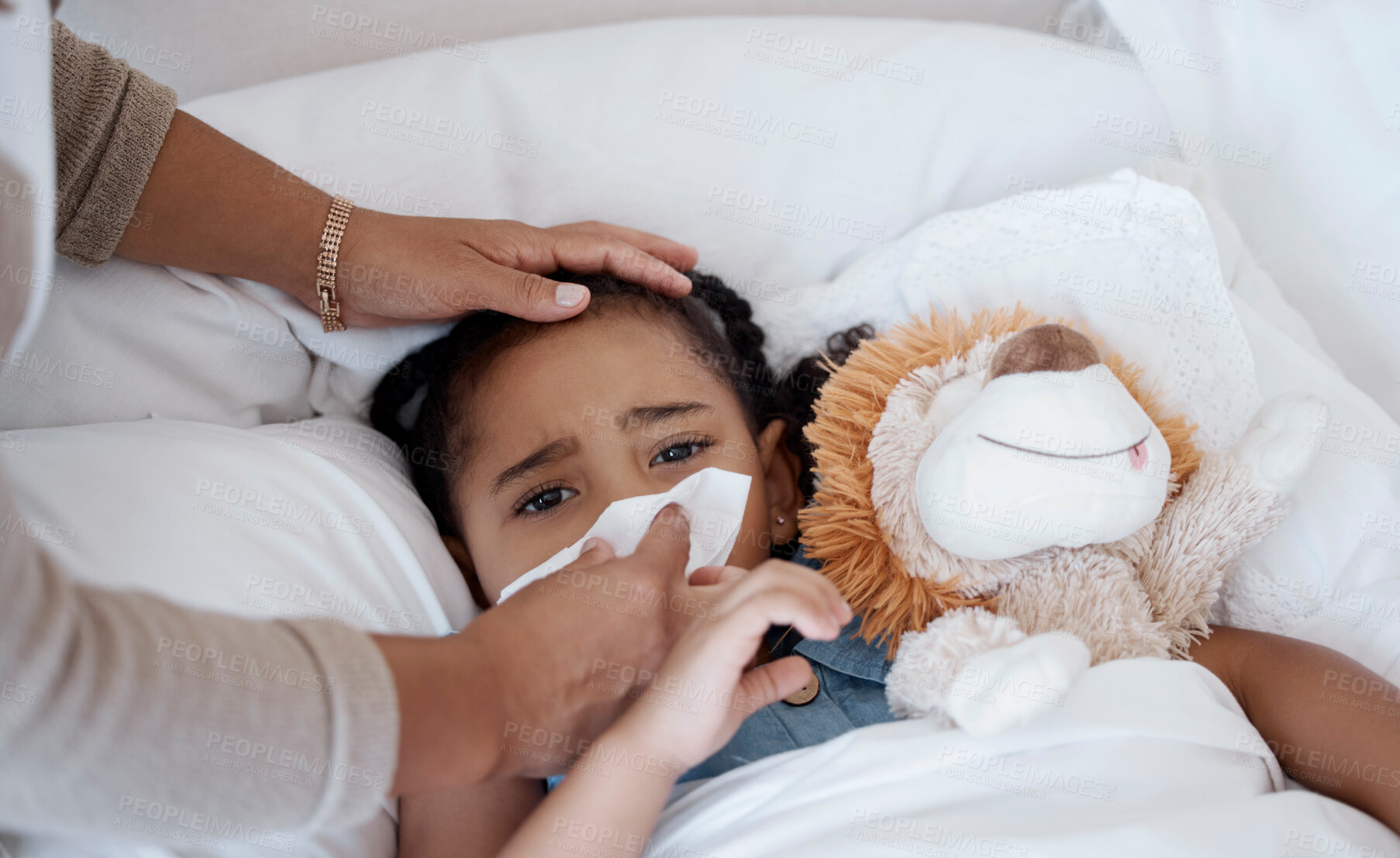 Buy stock photo Sick child, concerned mother and covid symptoms while in bed for health problem or fever while wiping nose with tissue. Woman caring for sad girl with virus, cold or flu in bedroom at home