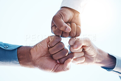 Buy stock photo Fist bump, group support and team success in meeting at work, celebration of corporate win and team building in office. Hands of business employees giving motivation and agreement while planning