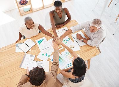 Buy stock photo Teamwork, meeting and hands together after a branding and logo group discussion at a business office table. Motivation, diversity and collaboration for our vision, mission plan and goals top view