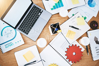 Buy stock photo Documents, finance and report with a laptop, gear and paperwork on a table or desk in a corporate office from above. Notepad, stationery and graphs on a wooden surface in a workplace for planning