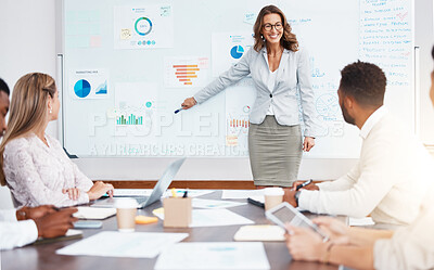Buy stock photo Business manager doing a corporate presentation to a team in the company conference room. Business meeting with graphs, charts and data paperwork for planning a management strategy on a project.