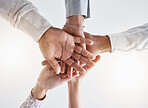 Teamwork hands, partnership and collaboration support for winner, motivation and vision of goals. Below business group people connect in trust, success commitment and working for solidarity together