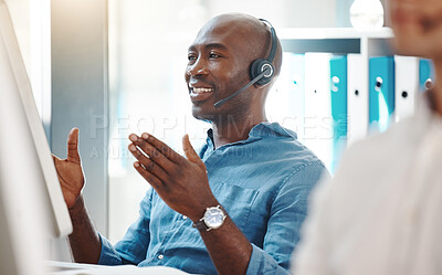 Buy stock photo Customer service, consultant and contact us for our call center employees to support in helping you with a loan. African Fintech insurance agent working at a computer desk happy to give you advice