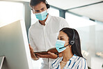 Covid, face mask and call center woman training intern on customer service computer, contact us and crm consulting office. Virus compliance, receptionist teamwork or learning consultant collaboration