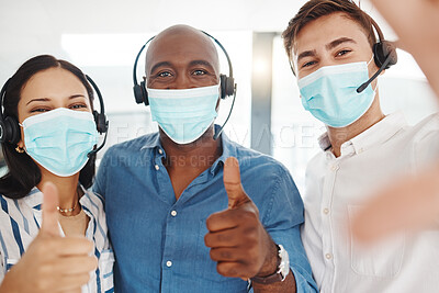 Buy stock photo Selfie of covid call center people with thumbs up in face mask for trust, success and thank you company portrait. Diversity telemarketing or customer service agent team for motivation in corona virus