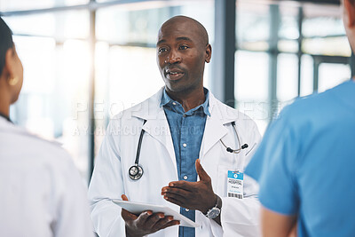 Buy stock photo Healthcare, planning and doctors collaboration on digital tablet, discussing surgery schedule at hospital. Leadership, vision and goal with proud african American man sharing goal for innovation 