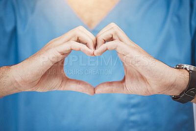Buy stock photo Doctor or nurse make heart sign, with hands to show care or compassion. Woman worker in healthcare show love icon with fingers, as expression of love for their job or wellness of patients