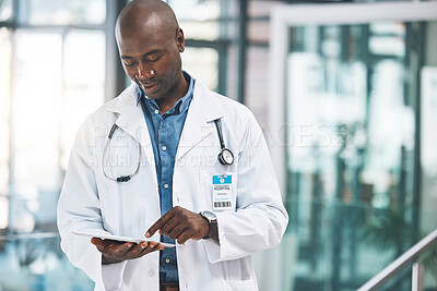 Buy stock photo Doctor with tablet, happy reading social media post, text or email from on break at hospital. Black man in healthcare career, on internet to research information on medical science and technology