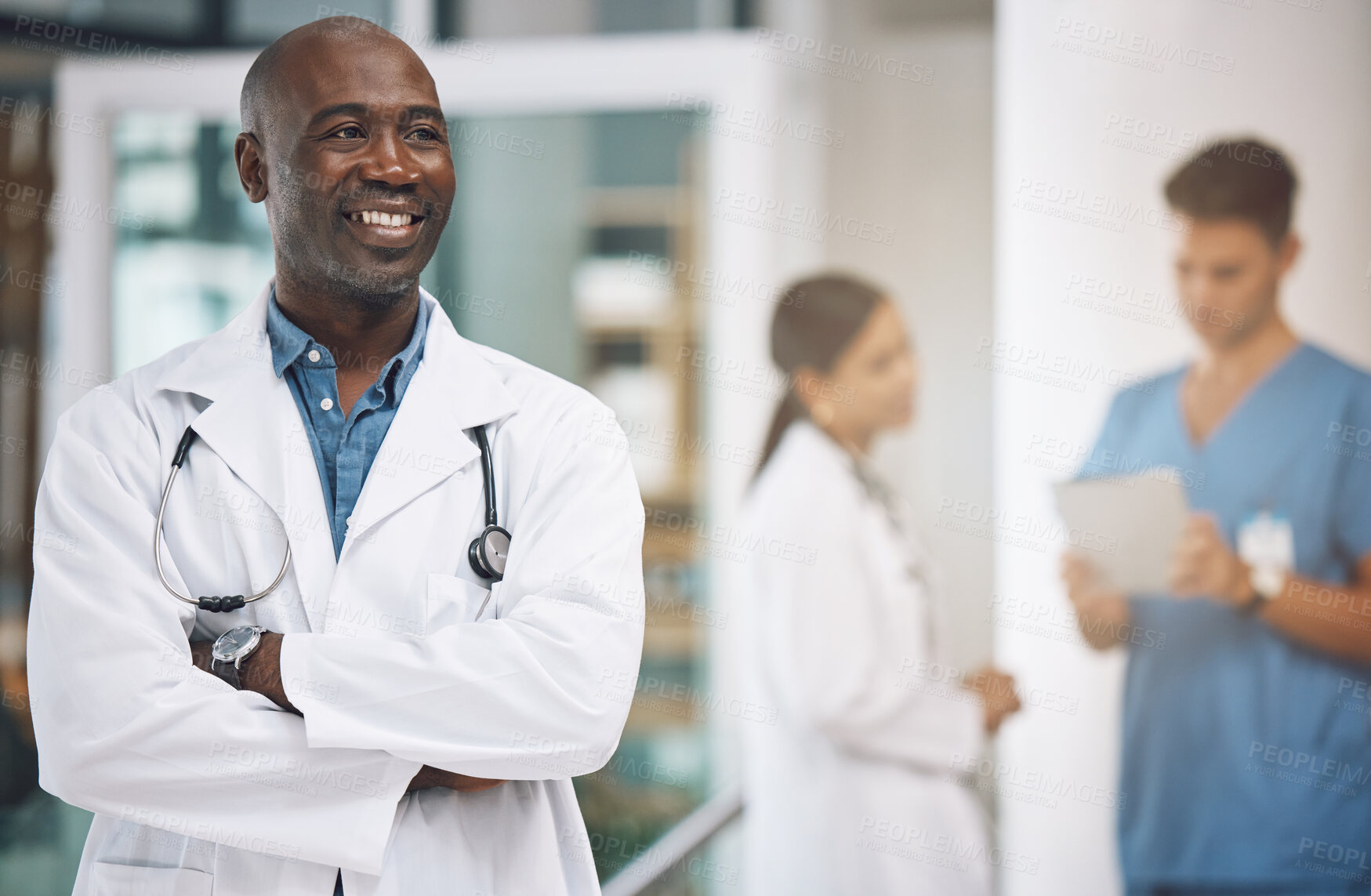 Buy stock photo Medical, healthcare and arms crossed with doctor in hospital for vision, trust and leadership. Support, innovation and motivation with black man employee in medicine, surgery and first aid clinic