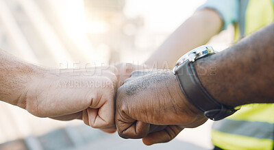 Buy stock photo Diversity, support and fist bump between an engineering team to celebrate success on a project. Closeup of teamwork, collaboration and hands of industry workers working together on an industrial site