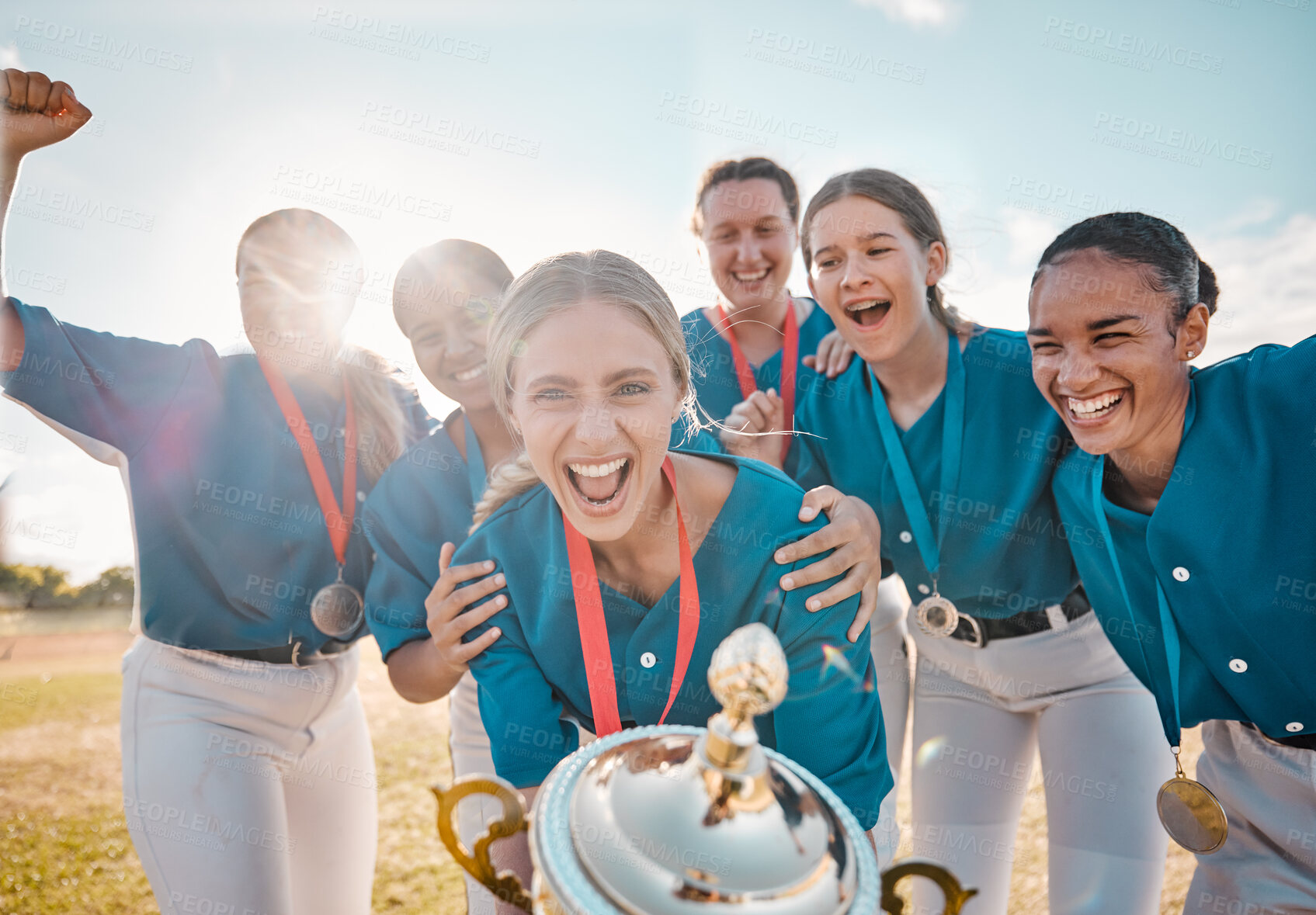 Buy stock photo Winning trophy and team of women in baseball portrait with success, achievement and excited on field with blue sky lens flare. Teamwork motivation and celebration of group of people or sports winner