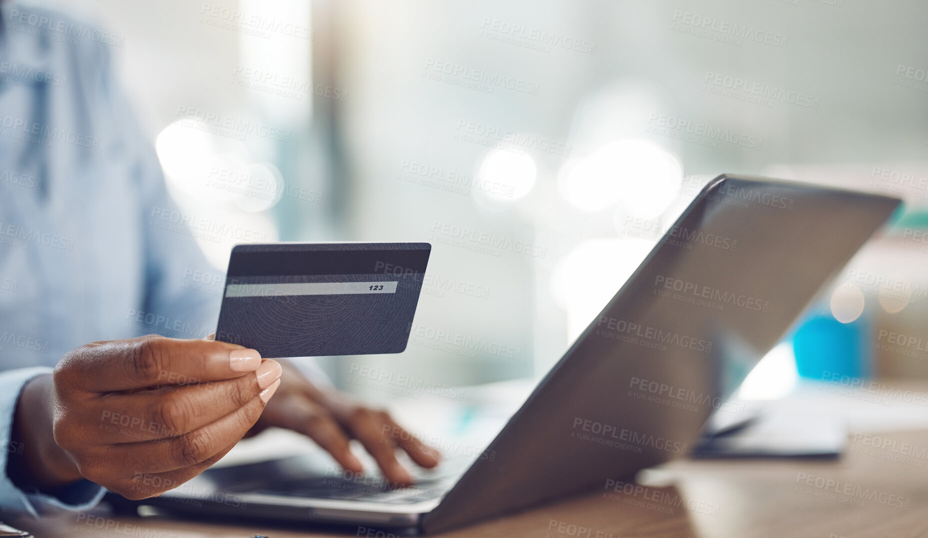 Buy stock photo Ecommerce, online shopping and credit card payment on a laptop via the internet for easy and fast digital cash exchange. African persons hands typing banking information on fintech to transfer money