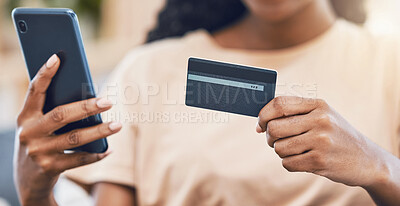Buy stock photo Black woman with a phone uses credit card for digital, online shopping and to buy ecommerce goods. Web security technology makes paying bills using fintech easy, simple and safe for retail customers 
