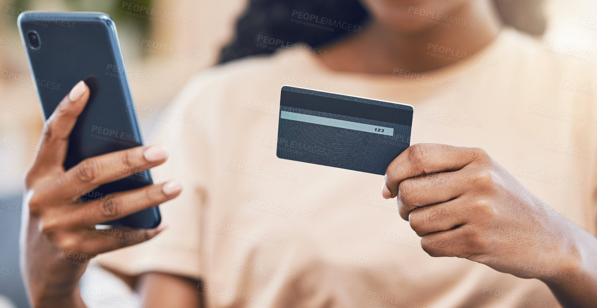 Buy stock photo Black woman with a phone uses credit card for digital, online shopping and to buy ecommerce goods. Web security technology makes paying bills using fintech easy, simple and safe for retail customers 