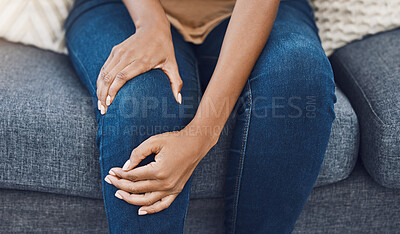 Buy stock photo Black woman, hands and knee injury pain for person on house living room sofa or home interior lounge. Zoom on healthcare, wellness or medical surgery burnout, stress and legs muscle accident on couch