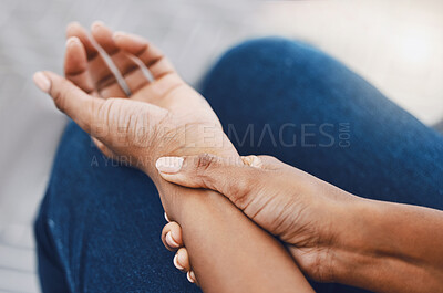 Buy stock photo Hands, arm injury or pain of black woman after working hard in home or house interior. Hand, health and wellness of African female injured wrist after work on pc computer, carpal tunnel or arthritis.