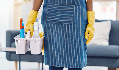 Buy stock photo Cleaning service, product basket and cleaner for maid advertising or marketing in living room apartment, home or house. Woman housekeeping worker hands with spray bottle and liquid detergent in house
