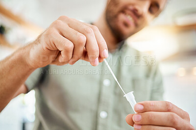 Buy stock photo Hands of man with home covid test to check for corona virus infection with medical health kit during pandemic. Patient, healthcare and sick man checking for flu risk with rapid covid 19 swab testing
