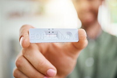 Buy stock photo Covid, rapid antigen test and hands with a negative result on a testing kit in the hand of a man during the pandemic. Health, medical and insurance with a male showing his corona virus results