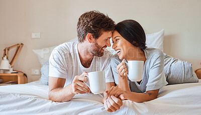 Buy stock photo Love, happy and a couple with coffee in bed on beautiful morning at home. Weekend, wake up and smile, woman and man relax with hot drink in bedroom. Romance, happiness and drinking sweet tea together
