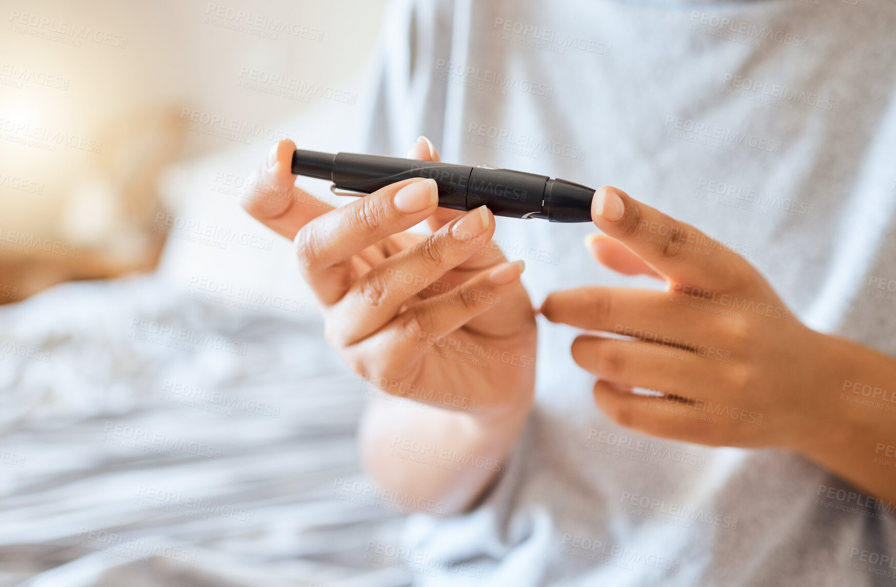 Buy stock photo Healthcare, diabetes, and a woman using blood sugar test on finger in bedroom alone. Health, innovation and the daily life of a diabetic lady on bed with glucometer to check glucose level at home.