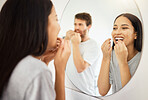 Mirror, dental floss and teeth healthcare couple cleaning mouth for healthy gums, smile and fresh breath. Man and woman in bathroom flossing morning during routine for dental hygiene in the morning