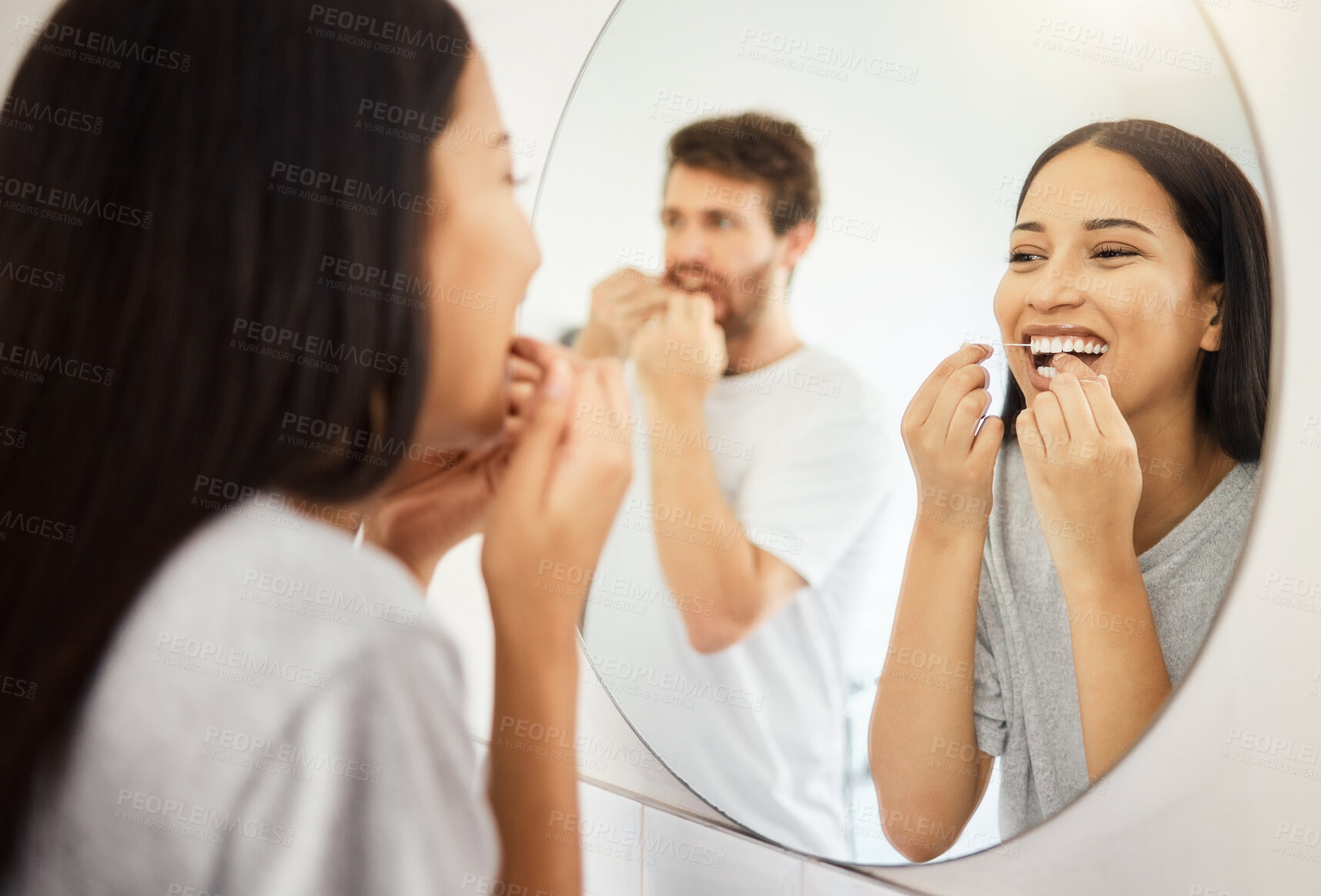 Buy stock photo Mirror, dental floss and teeth healthcare couple cleaning mouth for healthy gums, smile and fresh breath. Man and woman in bathroom flossing morning during routine for dental hygiene in the morning