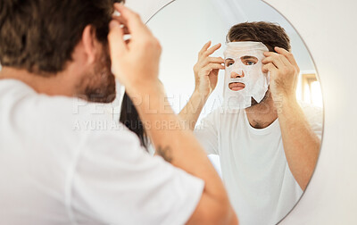 Buy stock photo Skincare, face and facial mask on man on mirror in home bathroom. Young male with self care, beauty or cosmetic cleaning for skin health and wellness for anti aging moisturizer product for detox