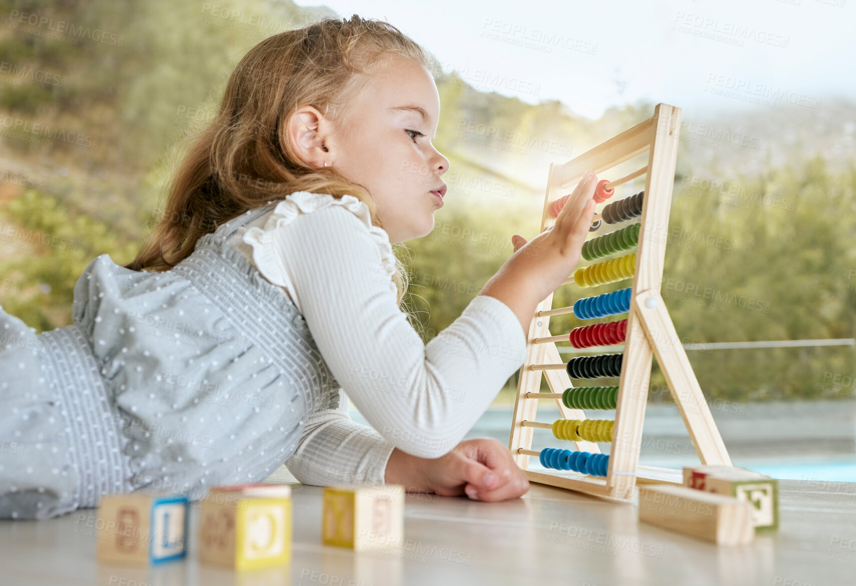 Buy stock photo Education, abacus and girl learning math with a color tool while counting on the floor. Young child or student play mathematics or calculate game with educational toy for academic knowledge in house