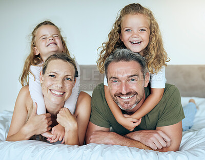Buy stock photo Family smile, happy portrait and children giving love hug to parents, happy on holiday vacation and relax on bed in home. Mother and father with happiness in bedroom with kids in the morning