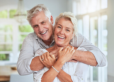Buy stock photo Love, couple and retirement with a senior man and woman looking happy and hugging in their home together. Smile, romance and relationship with an elderly male and female pensioner in a house