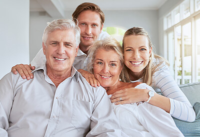 Buy stock photo Portrait of happy family bonding over the weekend on couch together. Parents visiting their adult son and daughter with a smile, love and support together on the sofa in the family home living room