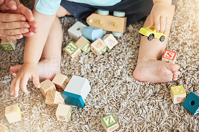 Buy stock photo Closeup of baby learning with toys, block puzzle and train to help hand eye coordination on floor in home. Young child learn with education games on carpet, for cognitive development and fun in house