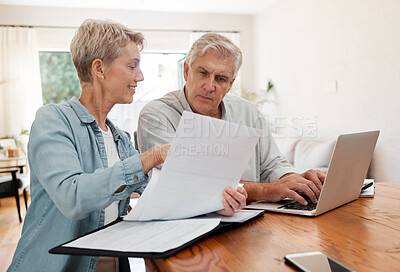 Buy stock photo Senior couple, laptop and home finance while reading paperwork documents and typing on computer for retirement savings, mortgage and online banking. Mature man and woman doing bill payment or booking