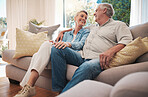 Retirement couple smile on sofa talking about happy marriage, pension and wealth in home or holiday house.  Hug, love and care senior woman with man relax on couch together in living room for summer