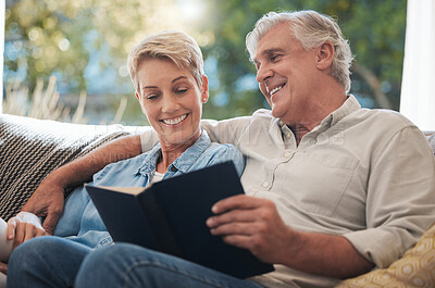 Buy stock photo Senior, pension and reading couple with a happy smile at home on a lounge sofa. Love, calm and happiness mindset of a elderly couple with books together looking at pages of a book on a house couch