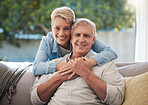 Couple, love and senior with a man and woman sitting on a sofa in the living room and enjoying retirement. Portrait of an elderly male and female pensioner in a home to relax and spend time together
