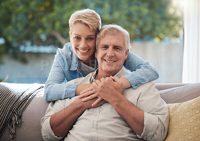 Buy stock photo Couple, love and senior man and woman sitting on a sofa in the living room and enjoying retirement. Portrait of an elderly male and female pensioner in a home to relax and spend time together