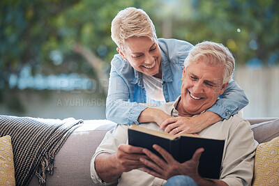 Buy stock photo Mature couple, bond and funny book on house or home sofa in garden and backyard patio. Smile, happy or relax senior man and elderly woman in retirement hug, trust or security love marriage with novel